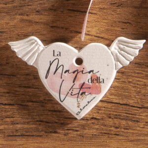 Ciondolo gesso cuore ex voto con scritta: "La magia della vita" rosa