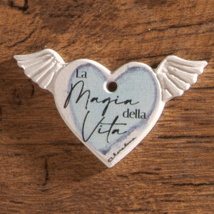 Ciondolo gesso cuore ex voto con scritta: "La magia della vita" azzurro