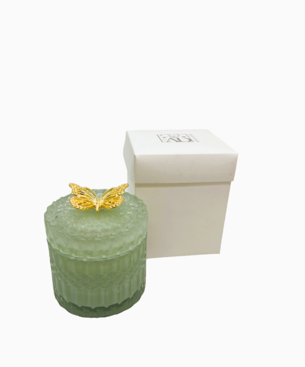 Candela in vetro verde con farfalla oro